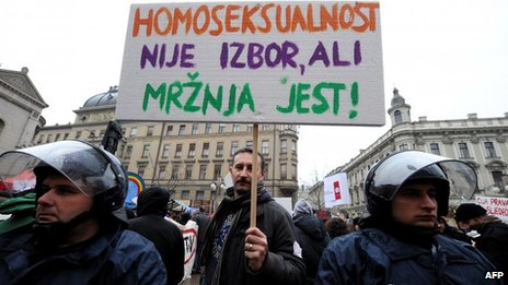 A protester's sign reads "Homosexuality is not a choice, hate is a choice" Photo courtesy BBC