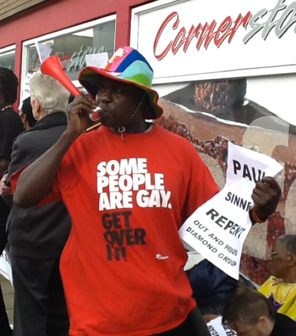 Protestor sends message SOME people are gay Shinners Get Over It!